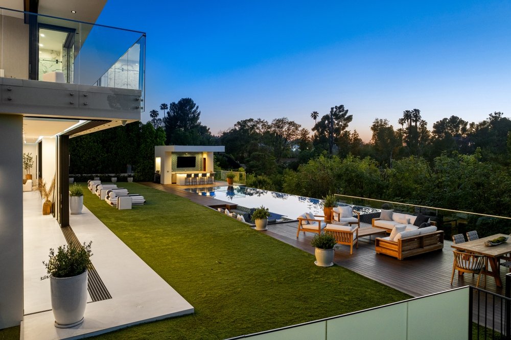 An,outdoor,living,space,with,deck,,pool,,and,furniture,at